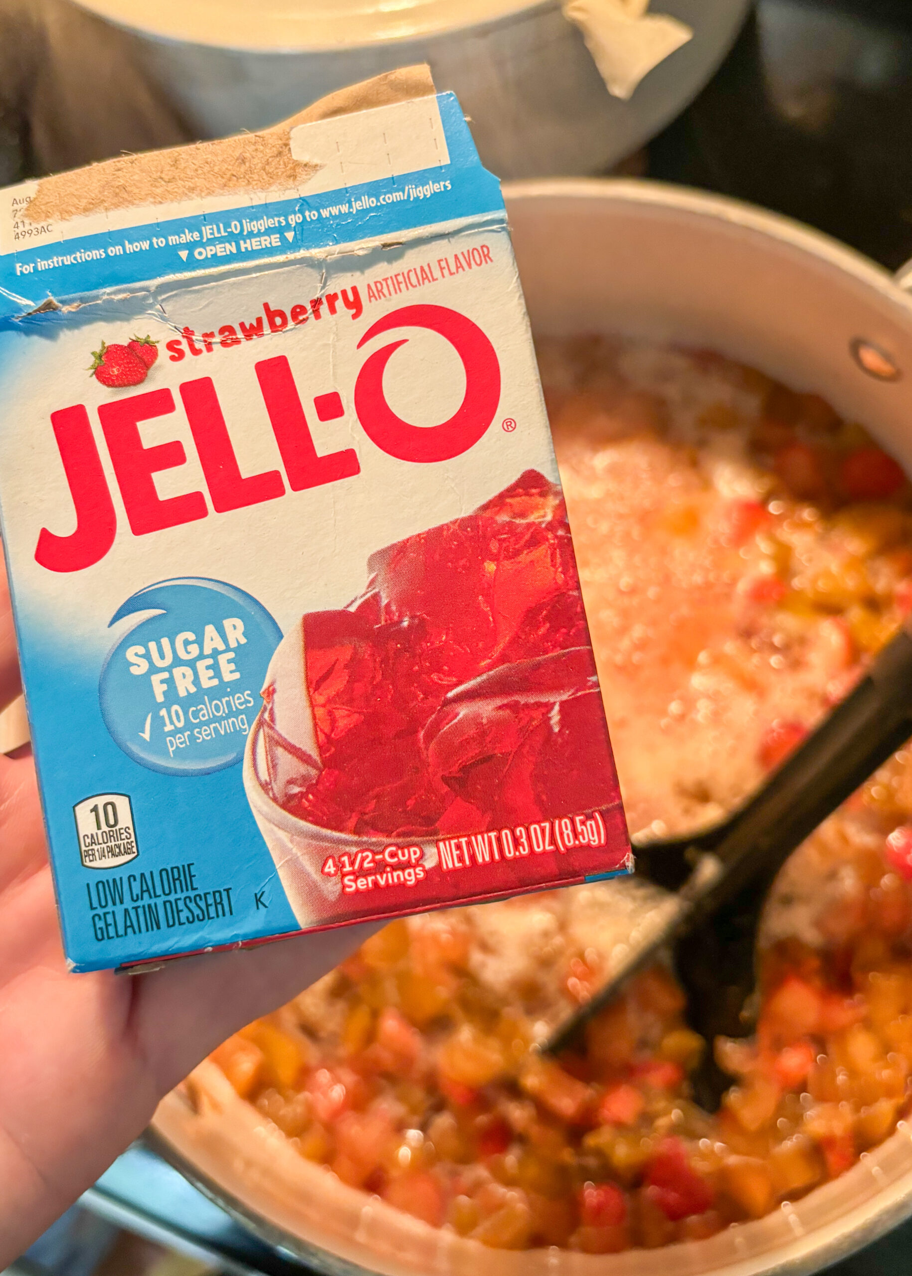 Adding strawberry jell-o mix to the rhubarb and strawberries to make jam without pectin