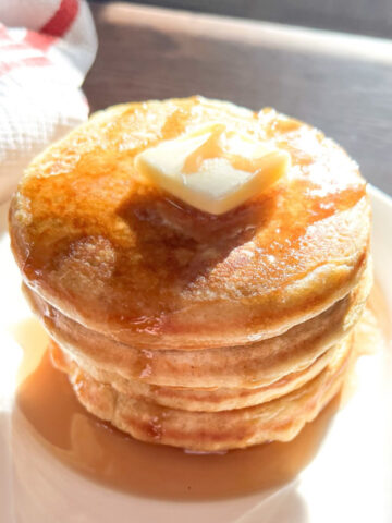 Sourdough discard pancakes with butter and maple syrup featured image