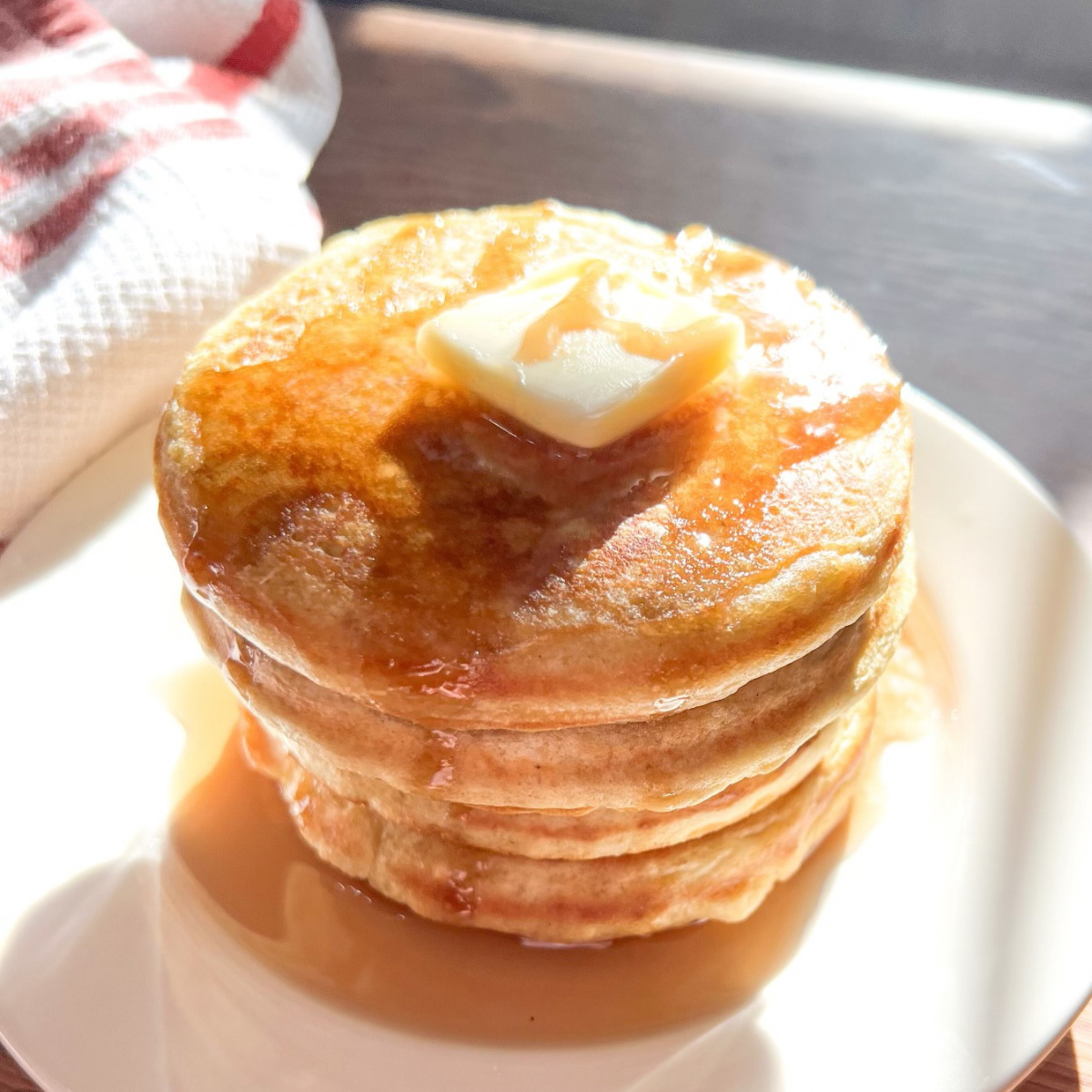 Sourdough discard pancakes with butter and maple syrup featured image