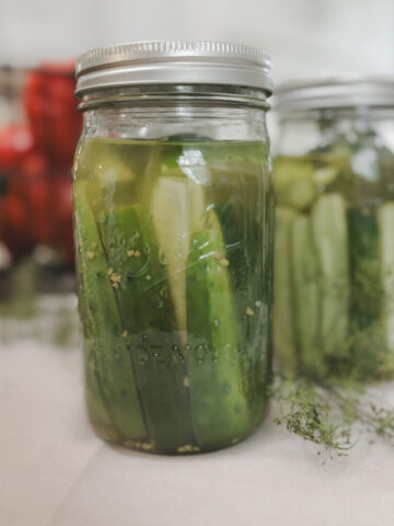 Featured image for homemade canned dill pickle cucumbers in jars