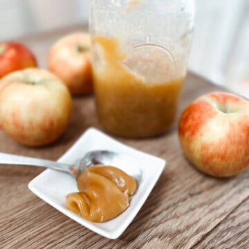 Finished whey caramel in a dish it’s apples surrounding