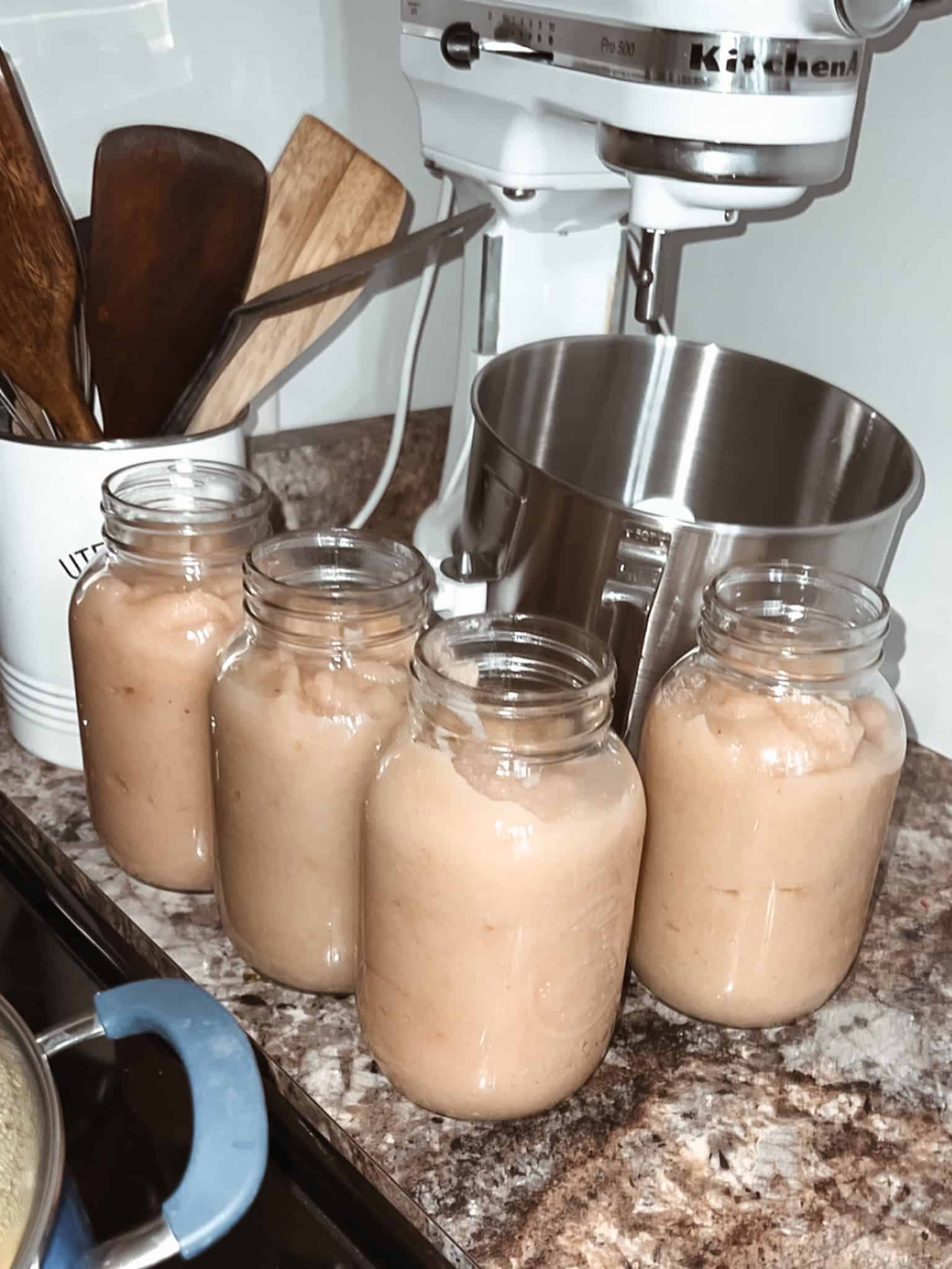 Jarred applesauce ready to be canned