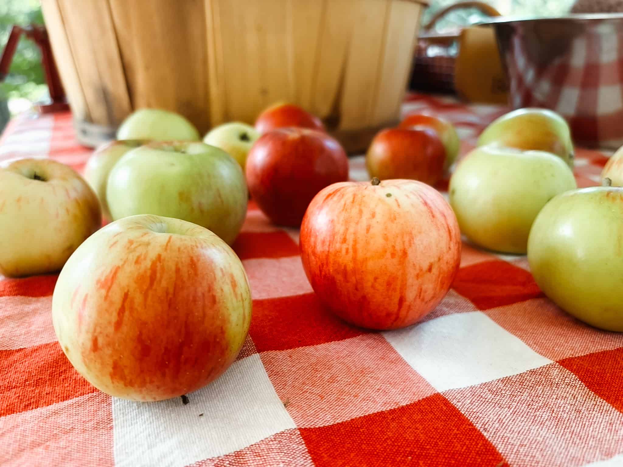 Apples scattered on tablecloth