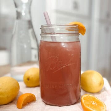 featured image for homemade electrolyte powder drink in a mason jar with oranges and lemons