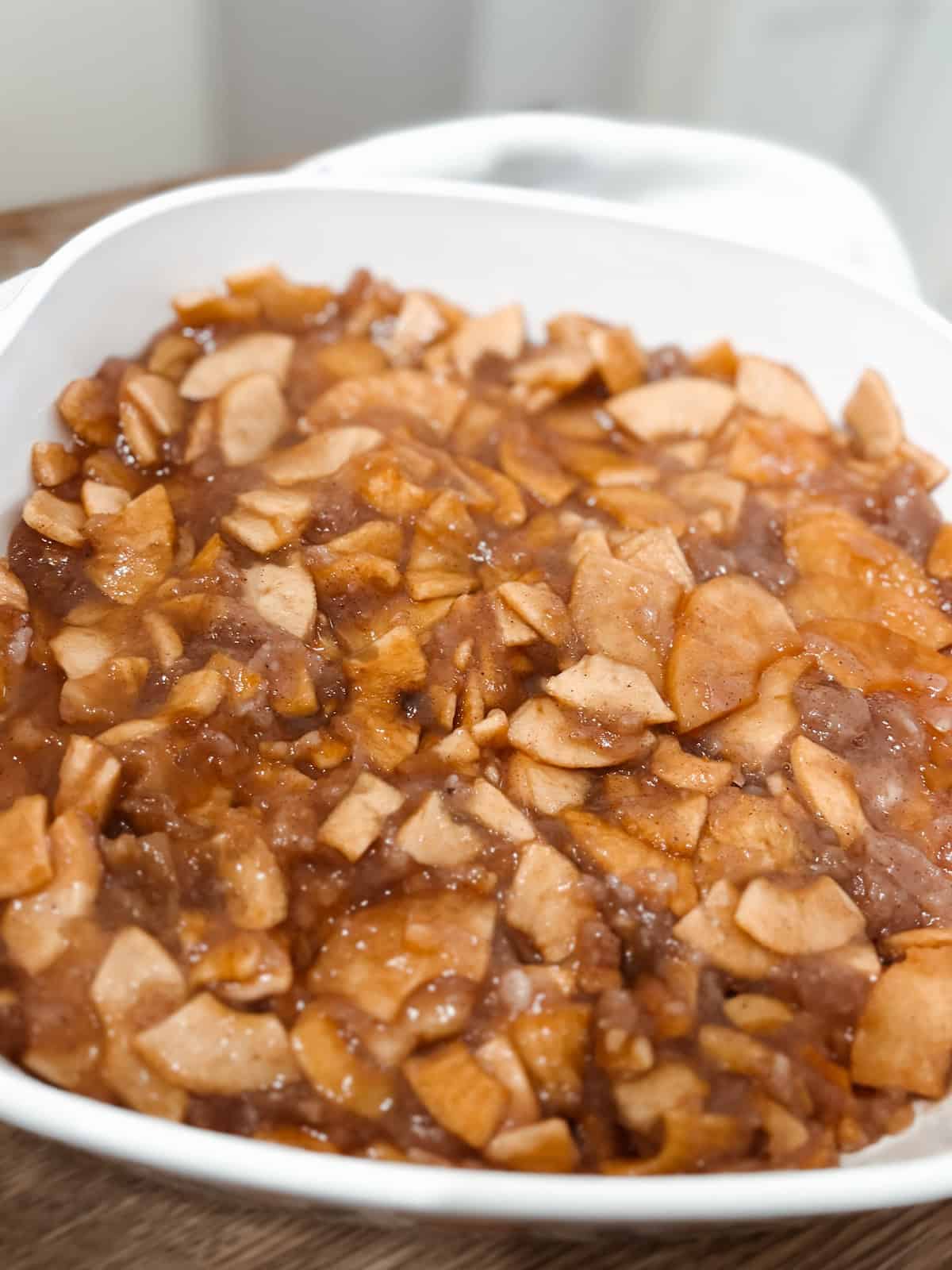 Homemade sourdough discard apple crisp step one, add apple pie filling to baking dish