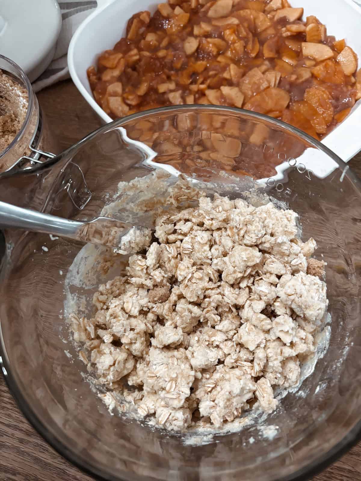 Homemade sourdough discard apple crisp step two, add crumb topping to the apples