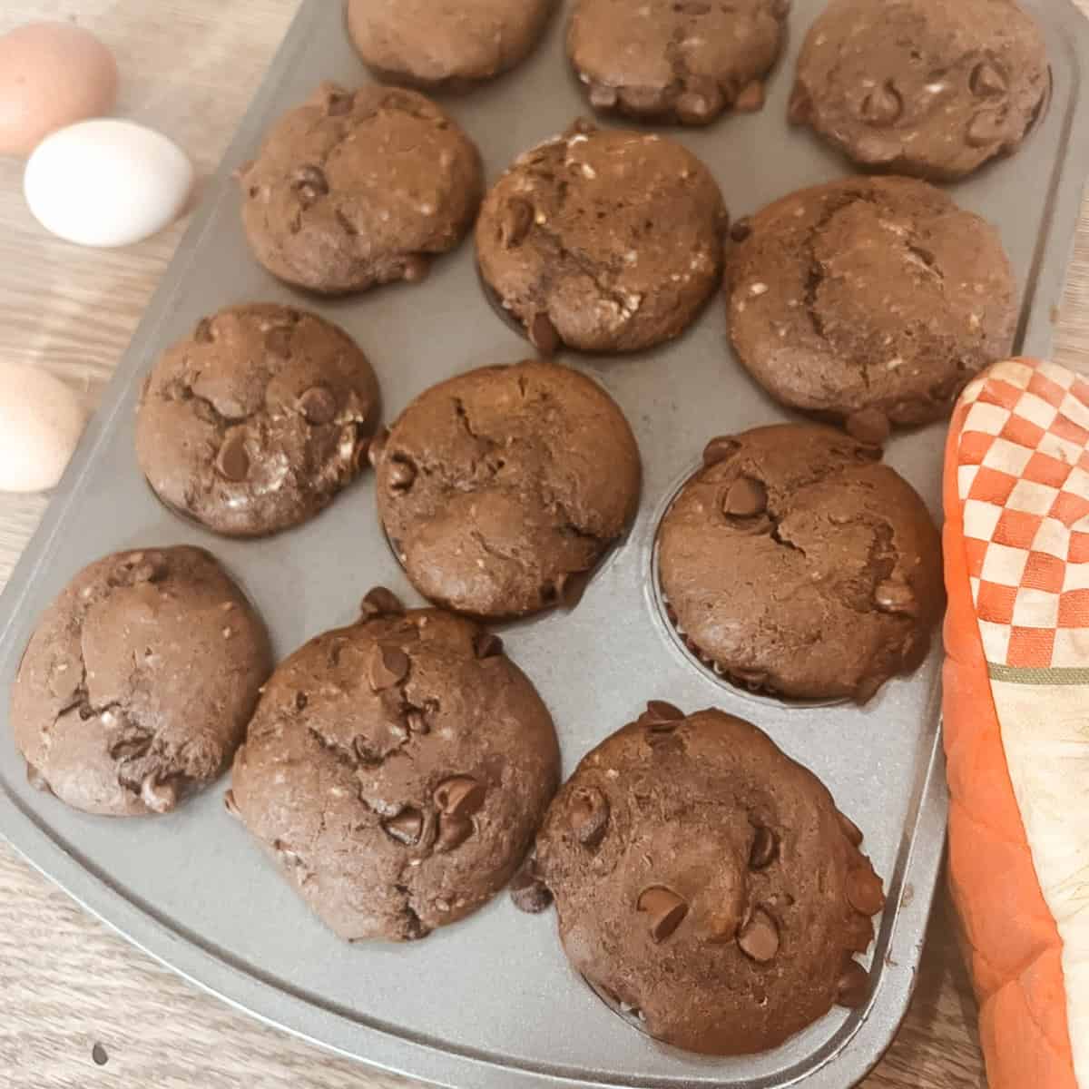 Featured image of baked double chocolate chip yogurt sourdough discard muffins
